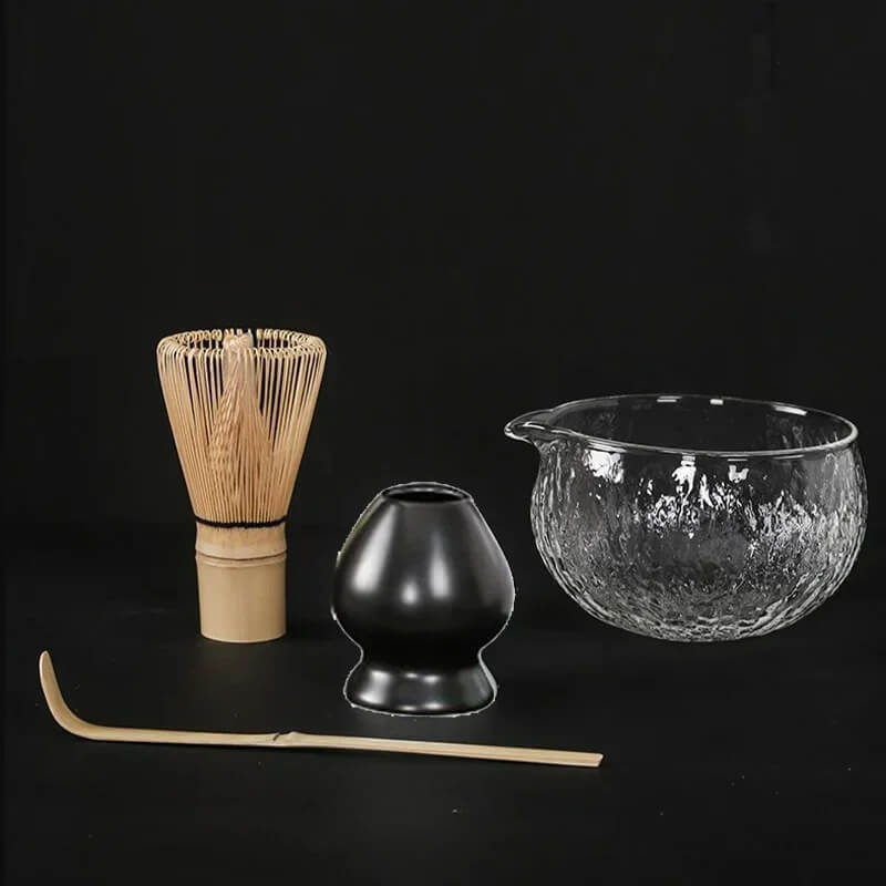 4 piece matcha tea set with glass bowl, black ceramic whisk holder, bamboo whisk and bamboo tea scoop