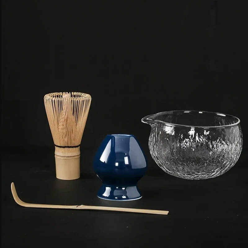 4 piece matcha tea set with glass bowl, blue ceramic whisk holder, bamboo whisk and bamboo tea scoop