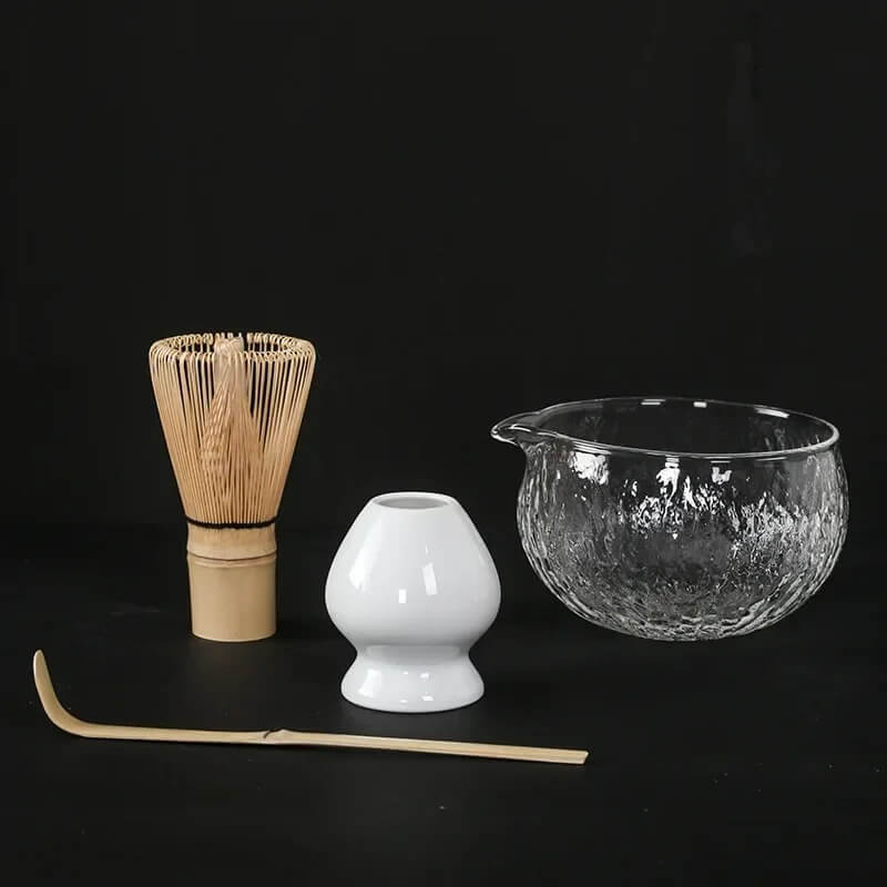 4 piece matcha tea set with glass bowl, white ceramic whisk holder, bamboo whisk and bamboo tea scoop