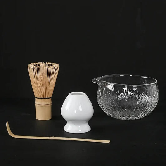 4 piece matcha tea set with glass bowl, white ceramic whisk holder, bamboo whisk and bamboo tea scoop